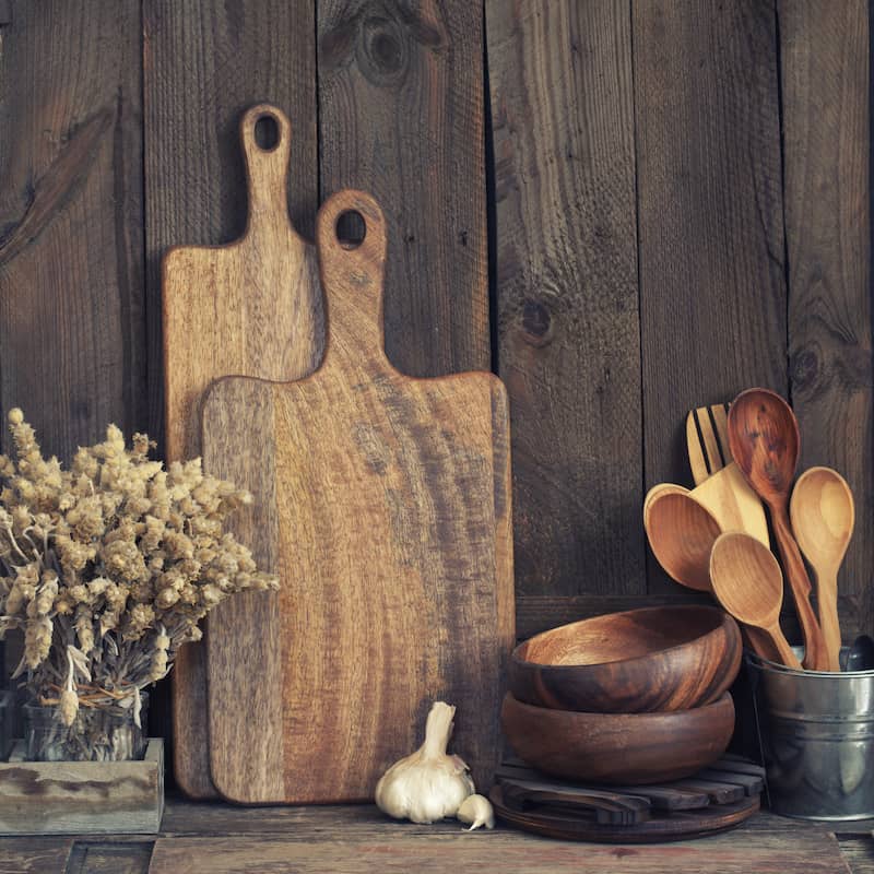 RHB Assets From IGX: A kitchen with rustic utensils hanging from a rack.