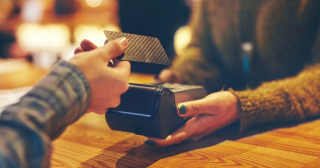 Person making a transaction with a credit card.