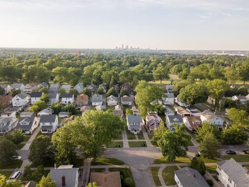 Aerial view of neighborhood in Parma, Ohio with view of Cleveland in far distant background.