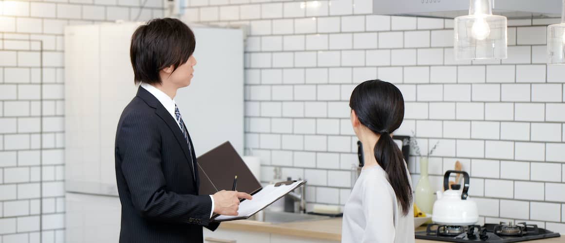 A real estate agent showing women a property possibly for the purpose of sale or rent.