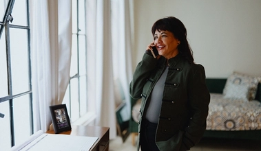 A woman on the phone with a home loan expert asking questions about amortization.