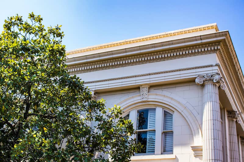 RHB Assets From IGX: Antebellum architecture in Tennessee, featuring a stately white mansion with large columns and a wraparound porch.