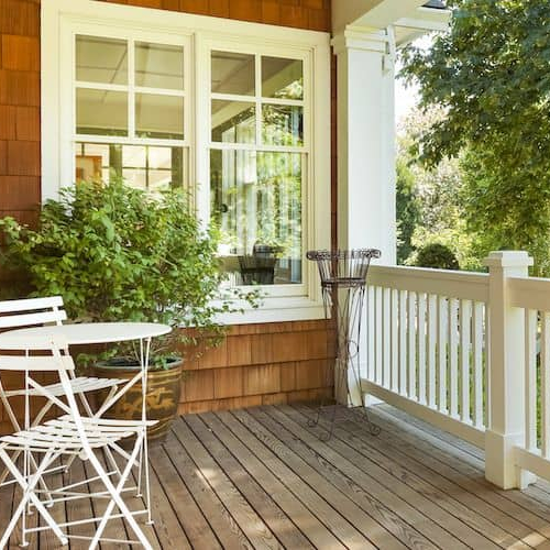 Front porch with chairs, creating a welcoming and cozy outdoor space.