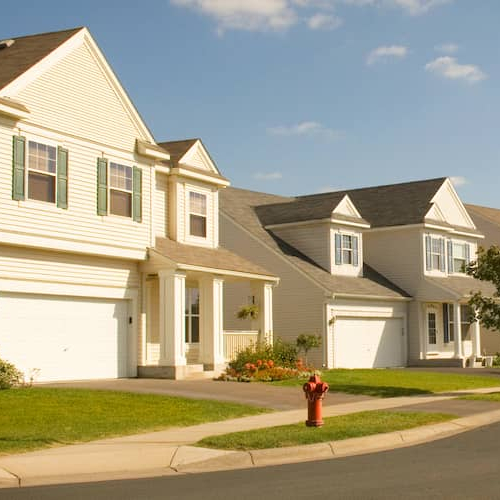 A vibrant image showcasing a community, possibly with people interacting, highlighting the concept of investing in neighborhoods.