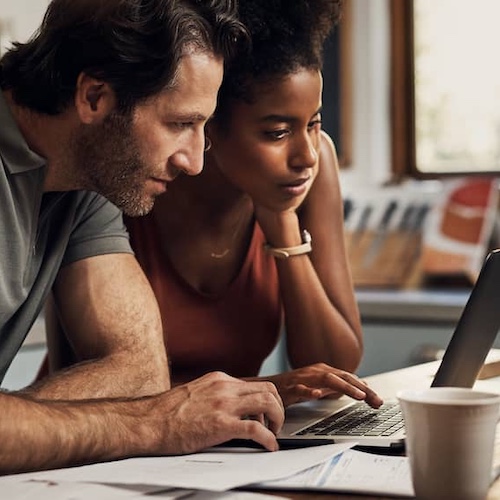 Couple on laptop.