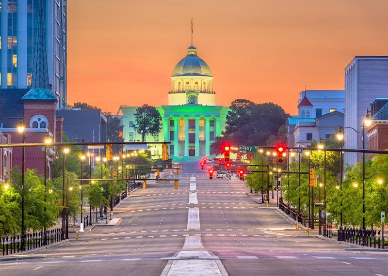 View of capital building lit up at night.