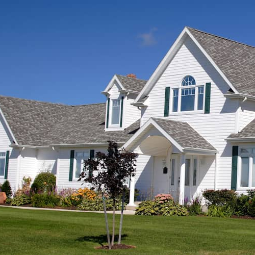A suburban home with green and well cared garden.