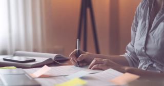 Businesswoman signing a contract.