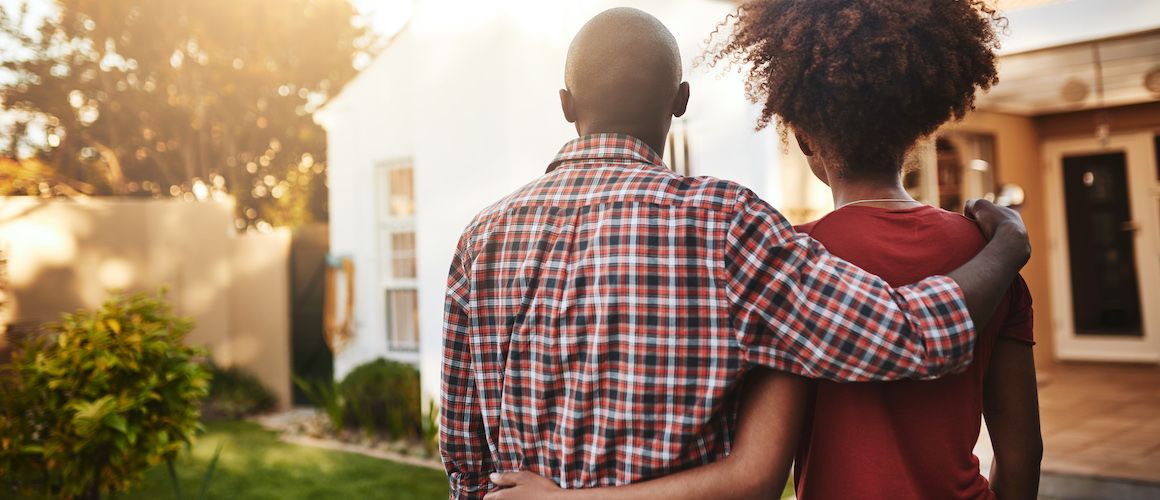 A couple in a backyard, potentially representing a couple spending time in a backyard setting.