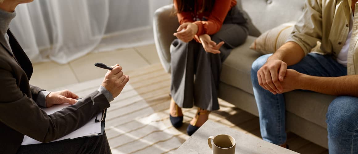 Couple meeting with marriage counselor.