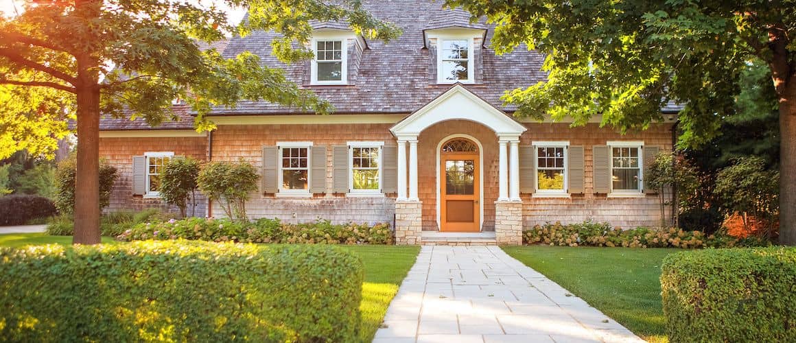 Exterior view of a large house, showcasing a spacious and elegant residential property.