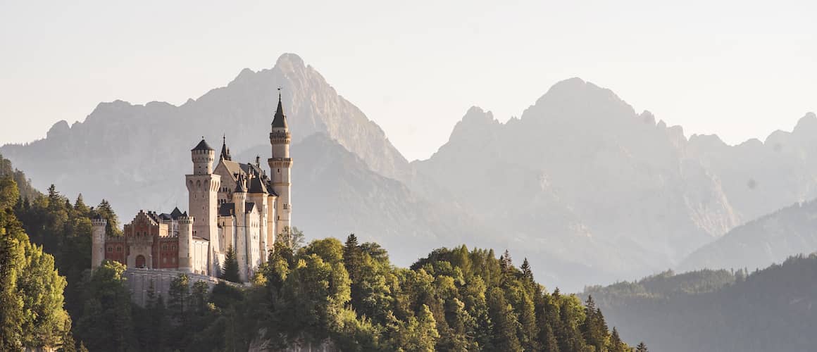 RHB Assets From IGX: Majestic German castle surrounded by lush greenery.