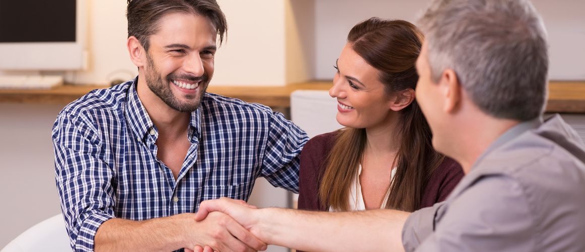 Stock-Couple-Shaking-Hand-To-Financial-Agent.jpg