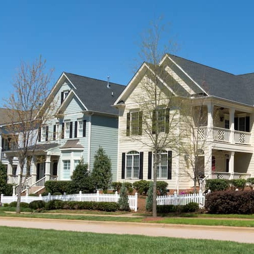 A picturesque neighborhood with a row of charming houses, creating a cozy and inviting atmosphere.
