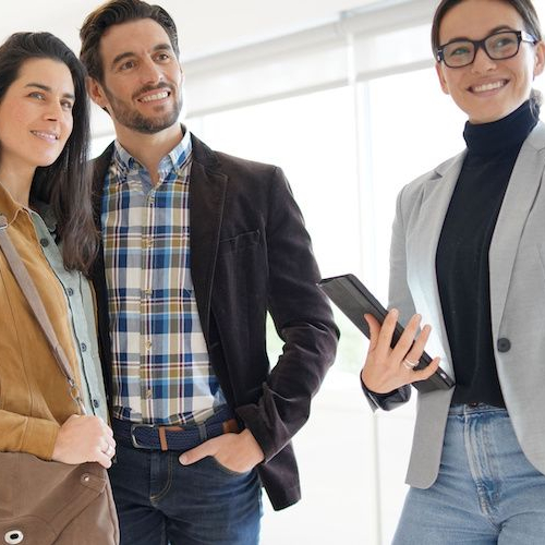 An agent showing a house, depicting a real estate agent presenting a property for sale or viewing.