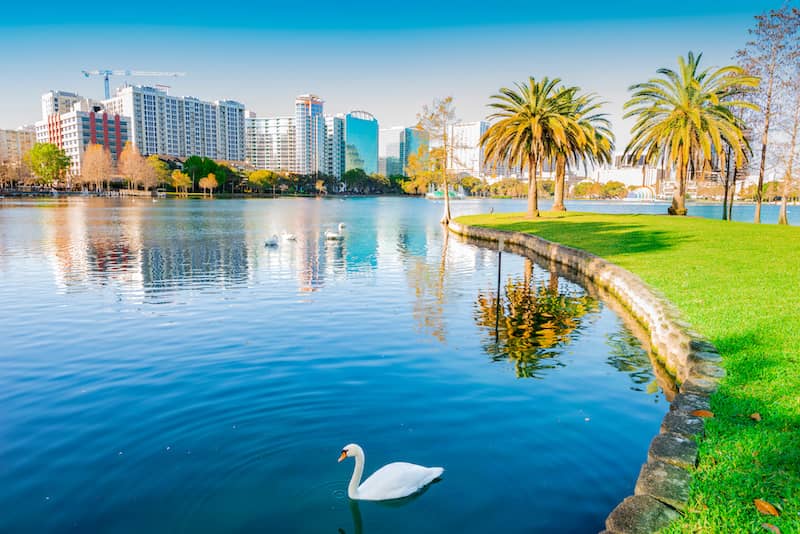 RHB Assets From IGX: Orlando, Florida skyline at sunset reflecting in a lake.