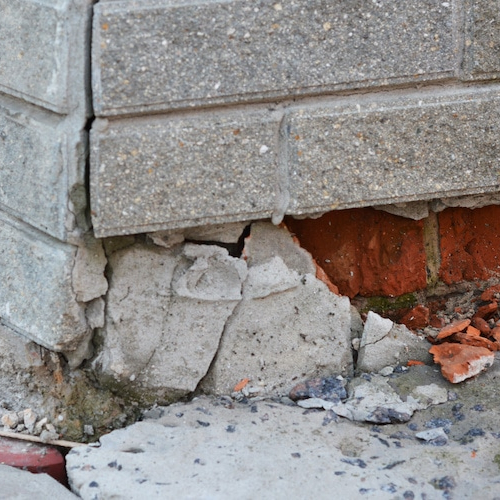 An image showing a broken foundation of a house, highlighting structural issues or concerns in a property.