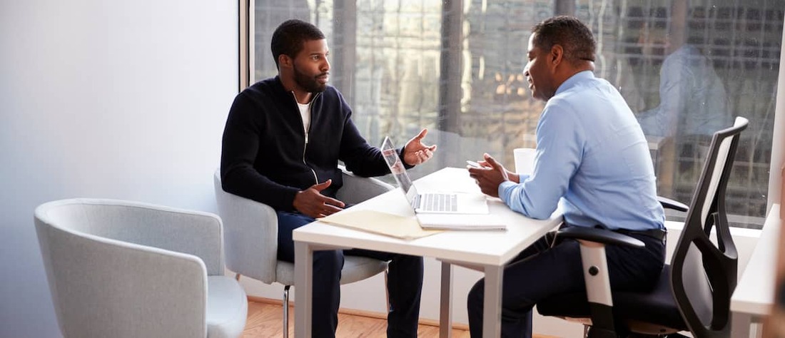 Man talking to financial advisor.