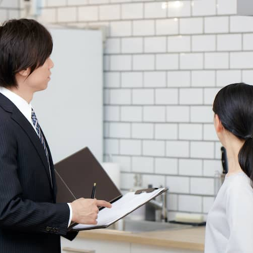 A real estate agent showing women a property possibly for the purpose of sale or rent.