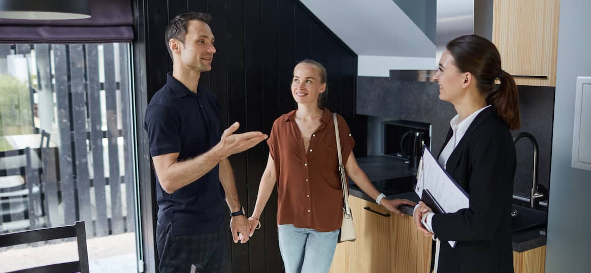 Woman looking in a closet, considering wardrobe organization options