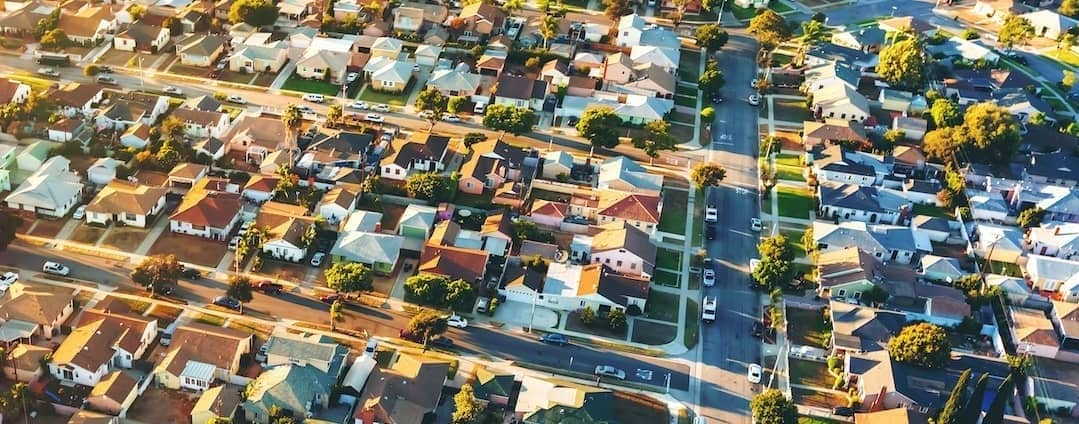 Neighborhood block, showcasing houses and streets in a residential area.