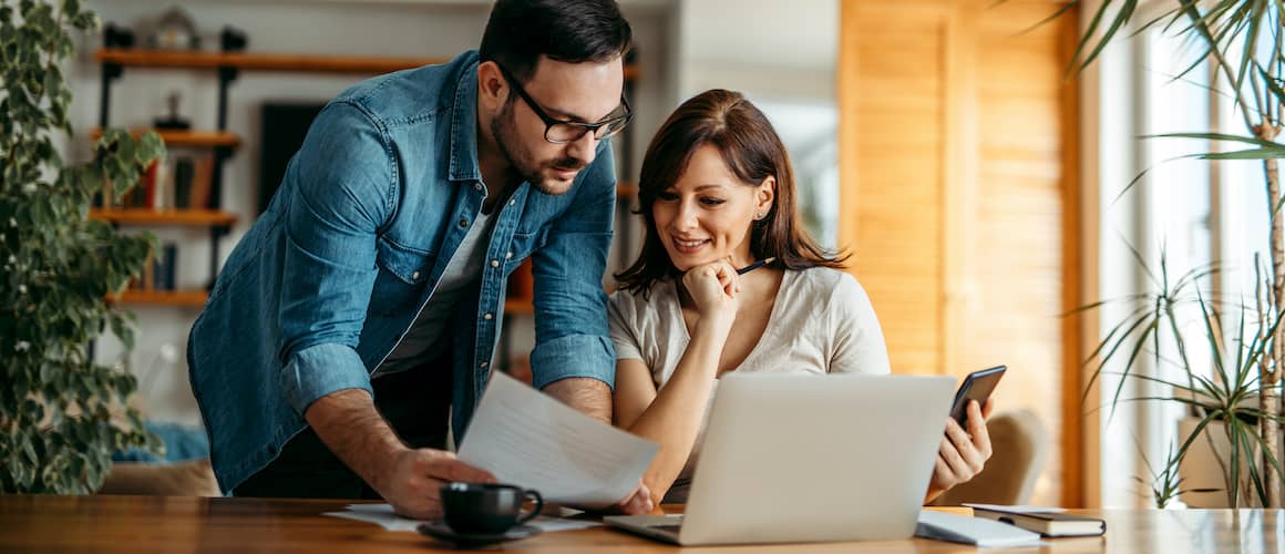 A man and woman possibly discussing switching lenders or financial arrangements related to a property.