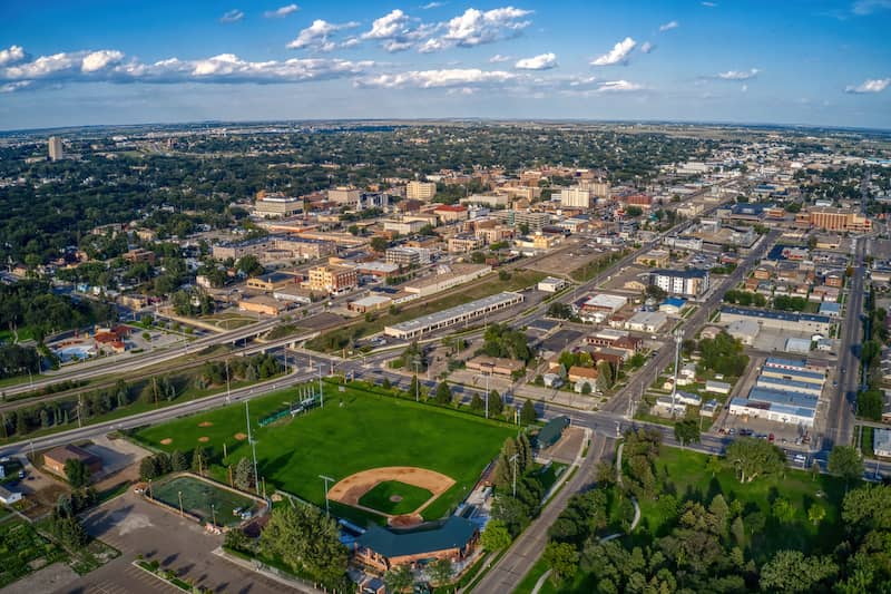 RHB Assets From IGX: Aerial view of Bismarck, North Dakota with the Missouri River in the background.