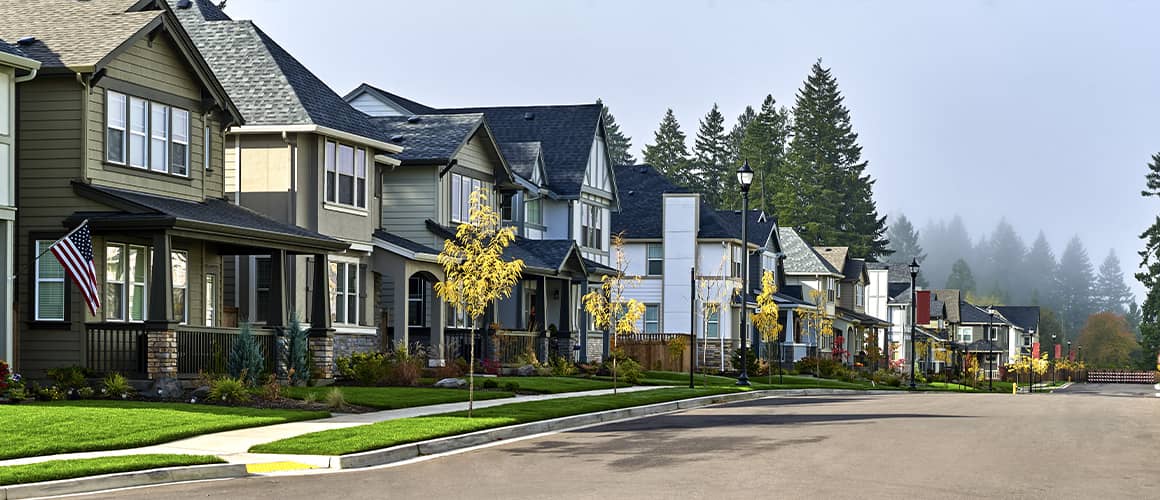 Rows of houses along a suburban neighborhood street.
