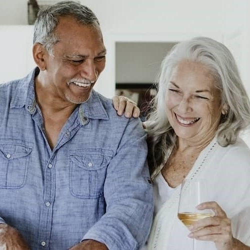 An older couple spending time together, potentially in a home setting.