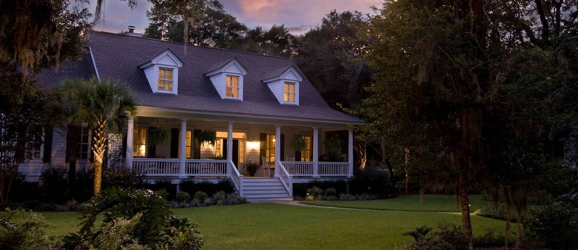 A house at dusk, depicting a home during twilight or evening.