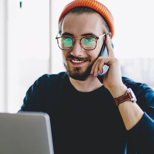 Man on phone getting mortgage pre-approval.