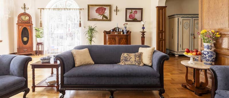 Cobalt-blue sofa and antique furniture inside a federal home.