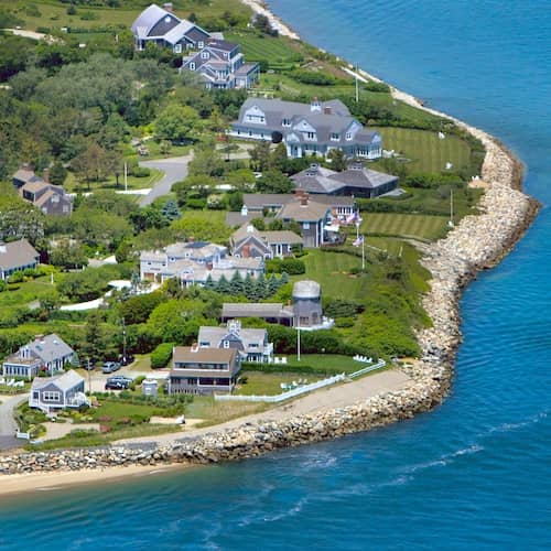 Beautiful oceanfront homes in the seaside town of Chatham in Cape Cod, Massachusetts on a calm, sunny day.