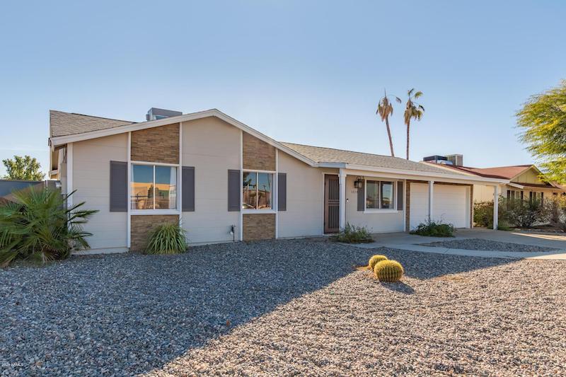 RHB Assets From IGX: Beautiful modern house in Phoenix with desert landscaping and palm trees.