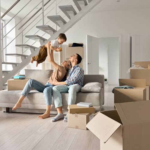 Couple with young boy moving into new house together.