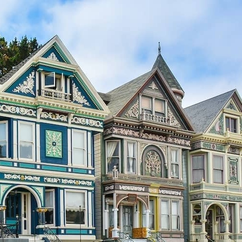 Row of historic painted Victorian homes.