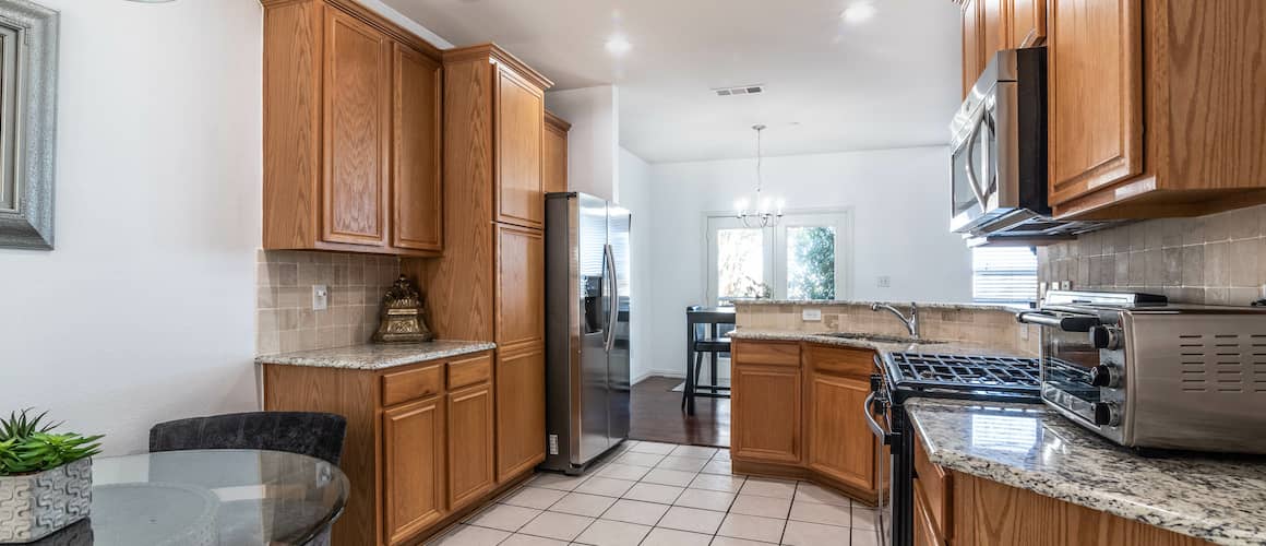 RHB Assets From IGX: Bland kitchen interior with beige cabinets