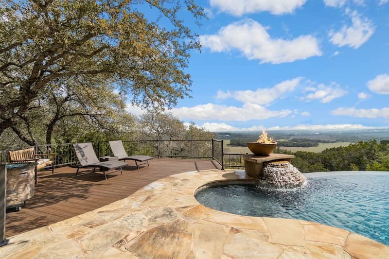 A pool with views of green hills in Iowa Park, Texas