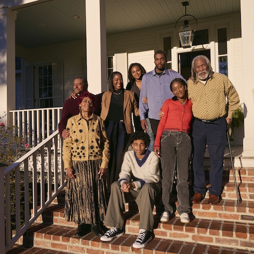 Family on steps of a home.