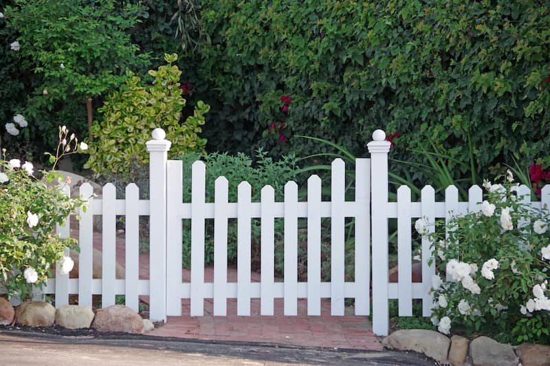 RHB Assets From IGX: Charming white picket fence surrounding a front yard.