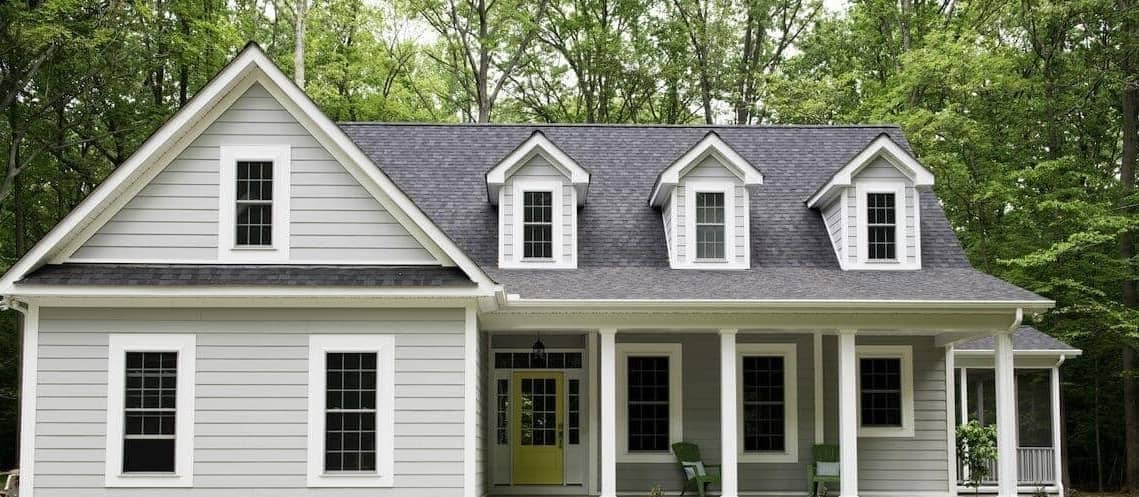 American style house with a yellow door.