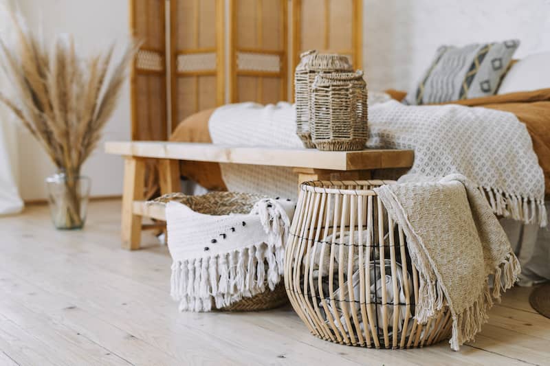 Warm, soft-colored baskets and blankets in a study.