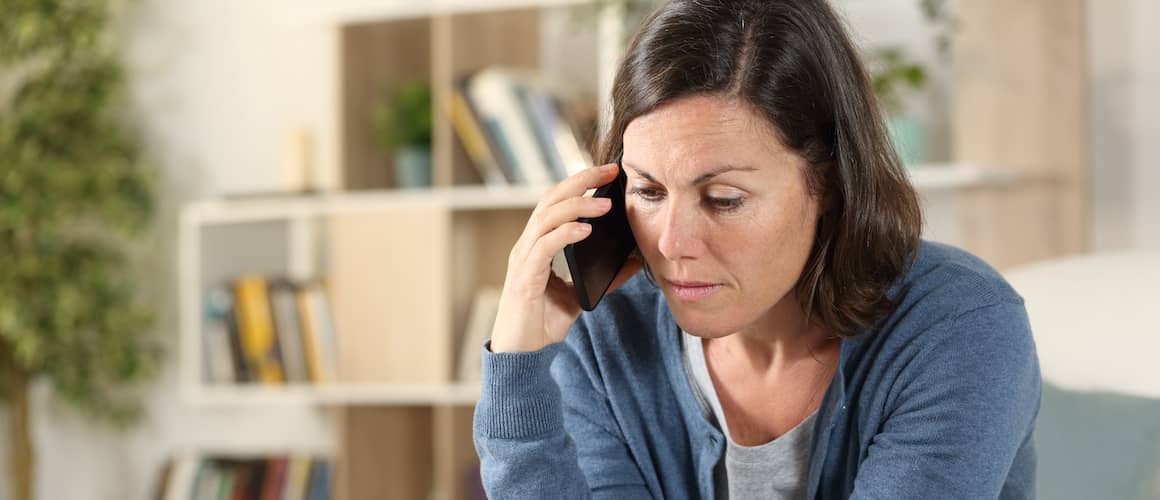 A women likely worried possibly after hearing some news on the phone.