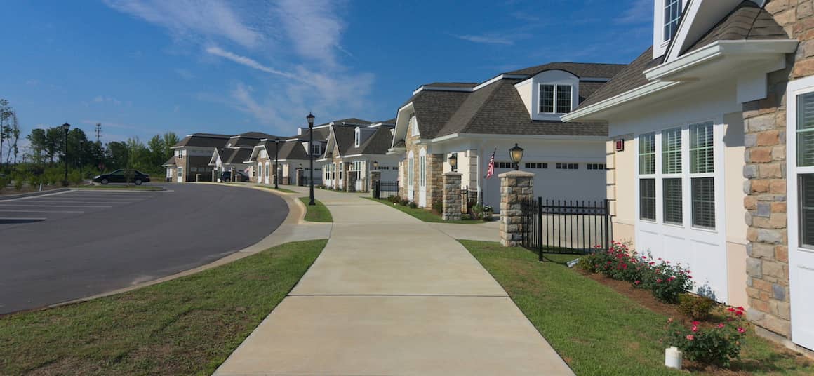 RHB Assets From IGX: A row of houses by a sidewalk