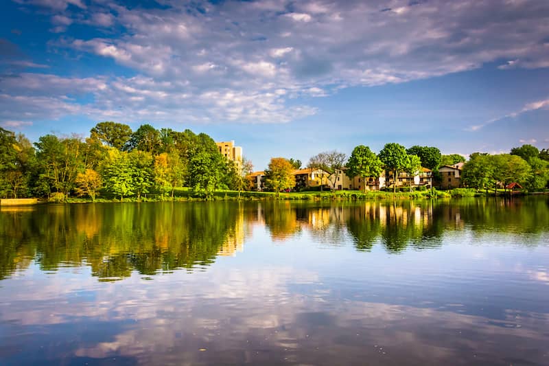 RHB Assets From IGX: Wilde Lake in Columbia, Maryland with a pedestrian bridge and lush surroundings