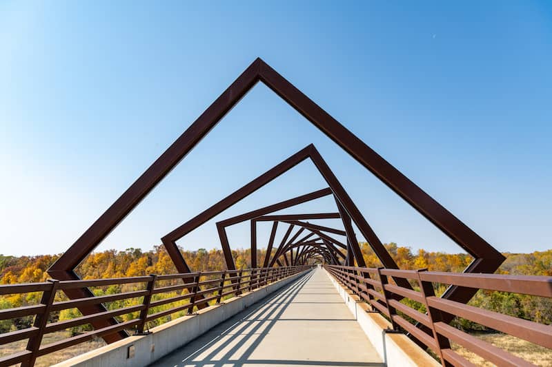 RHB Assets From IGX: Scenic bike trail surrounded by lush greenery and a winding path