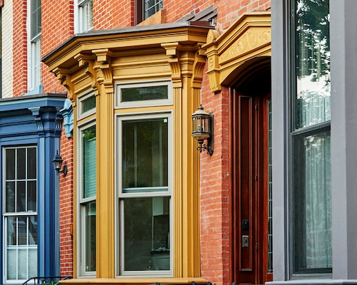Colorful apartments in an urban city, depicting vibrant and colorful urban apartments.