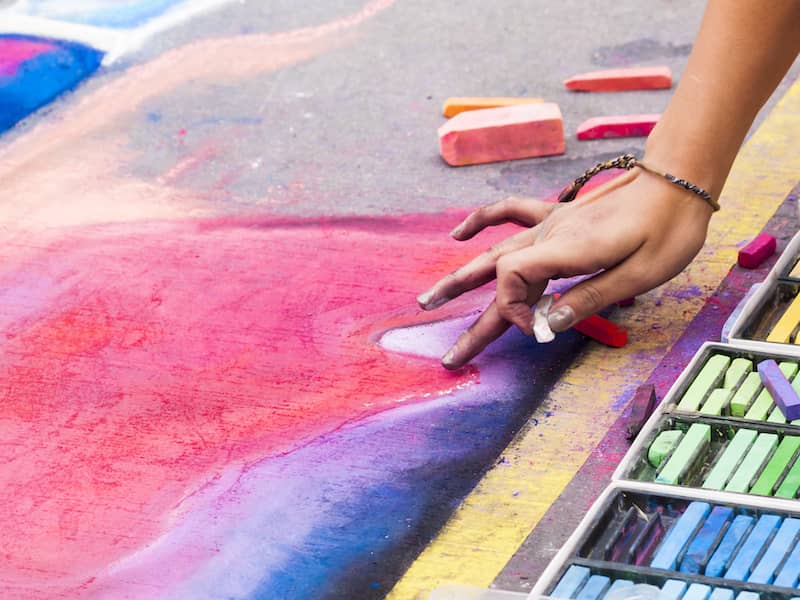 RHB Assets From IGX: Colorful chalk drawings on a street in Mount Vernon, Iowa.