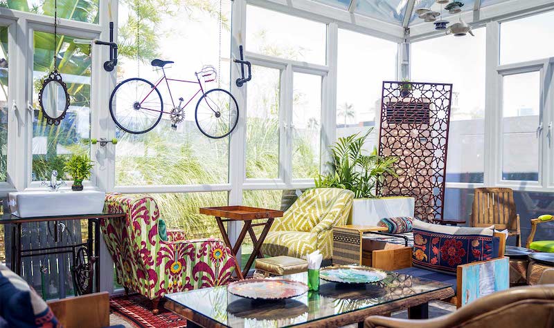 RHB Assets From IGX: Modern maximalism sunroom with bright colors and bold patterns