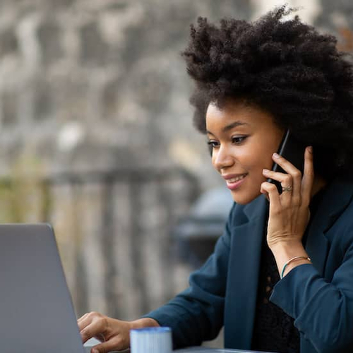A woman working on a computer, possibly related to remote work, finances, or digital activities.
